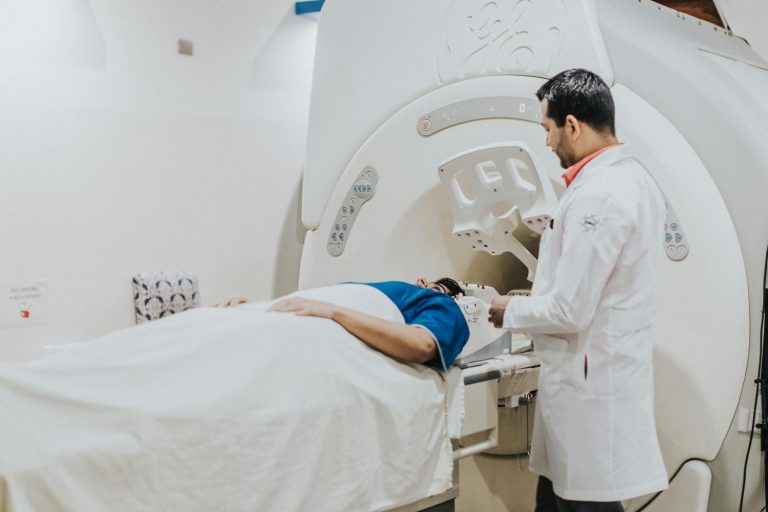 A patient is being scanned in a CT machine, demonstrating the quick and accessible process for a walk-in CT scan in Houston.