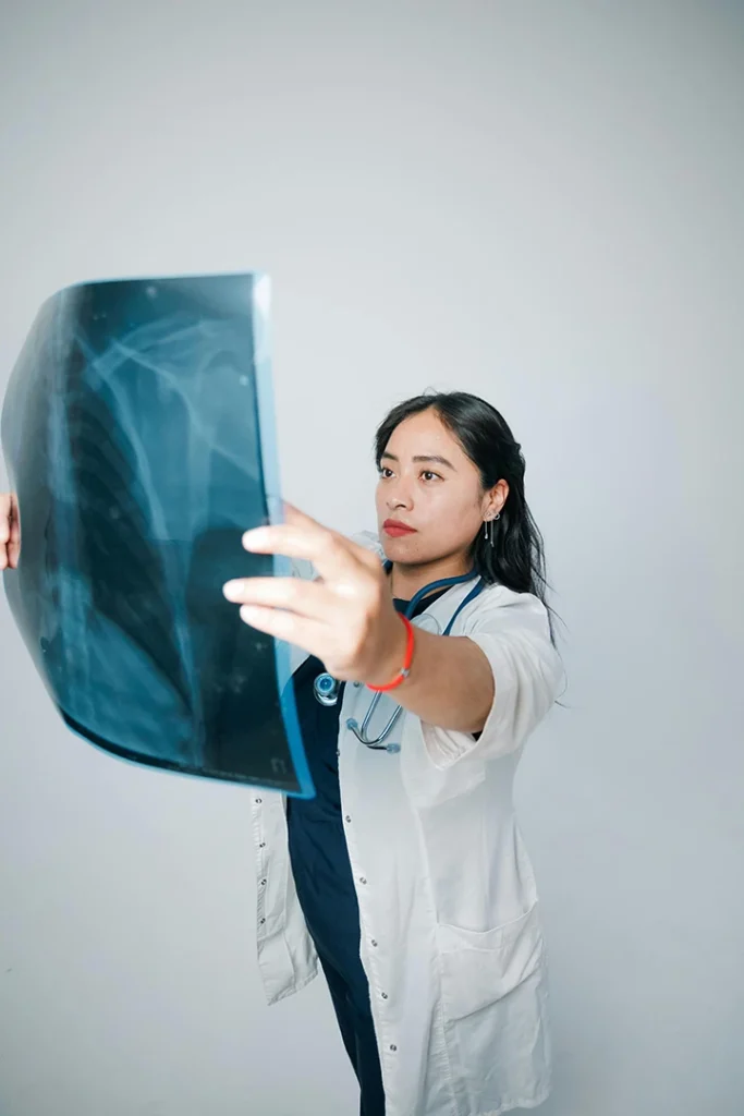 Professional technician operating modern X-ray equipment at x-ray services Houston, ensuring accurate diagnostics in a clean clinic setting.