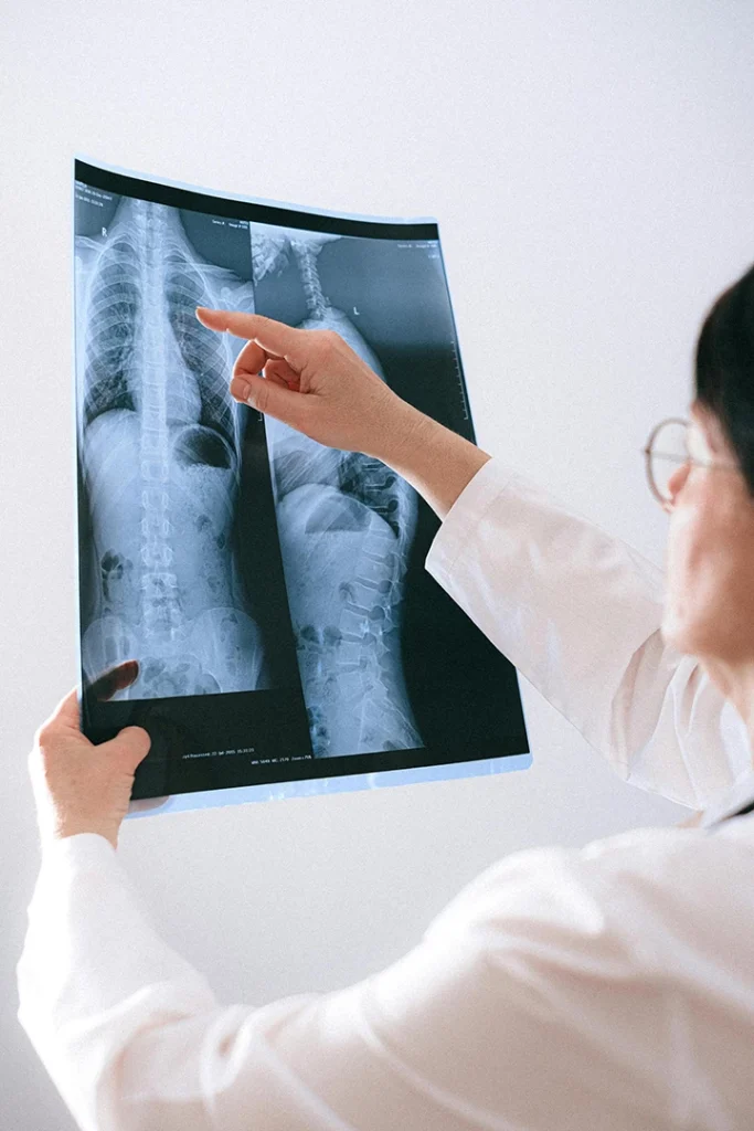 Skilled technician conducting X-ray scan with modern equipment for reliable x-ray services in Houston, in a bright and clean diagnostic facility.
