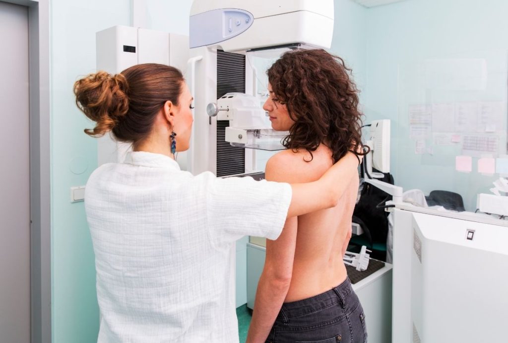 Healthcare professional assists patient with 3D Mammograms Houston screening for accurate breast cancer diagnostics