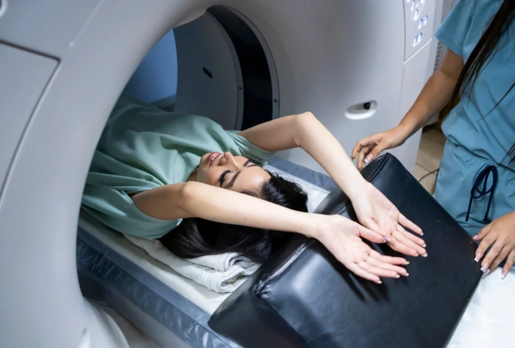 Patient receives cheap CT scan in Houston clinic with technician preparing for accurate diagnostic imaging procedure.