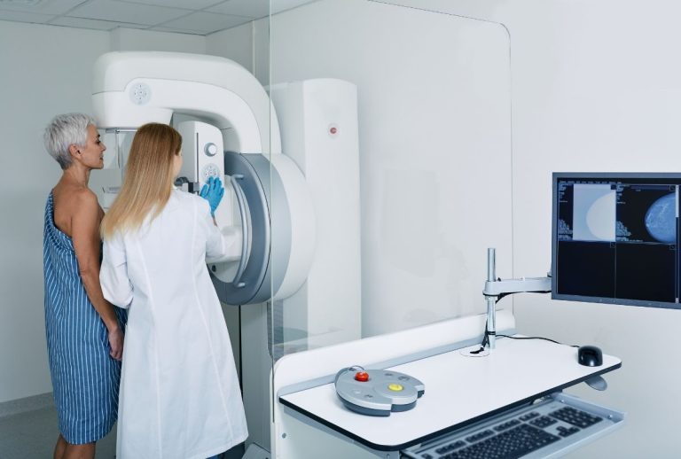 Technician prepares patient for 3D Mammograms Houston exam to ensure precise breast tissue imaging and early diagnosis