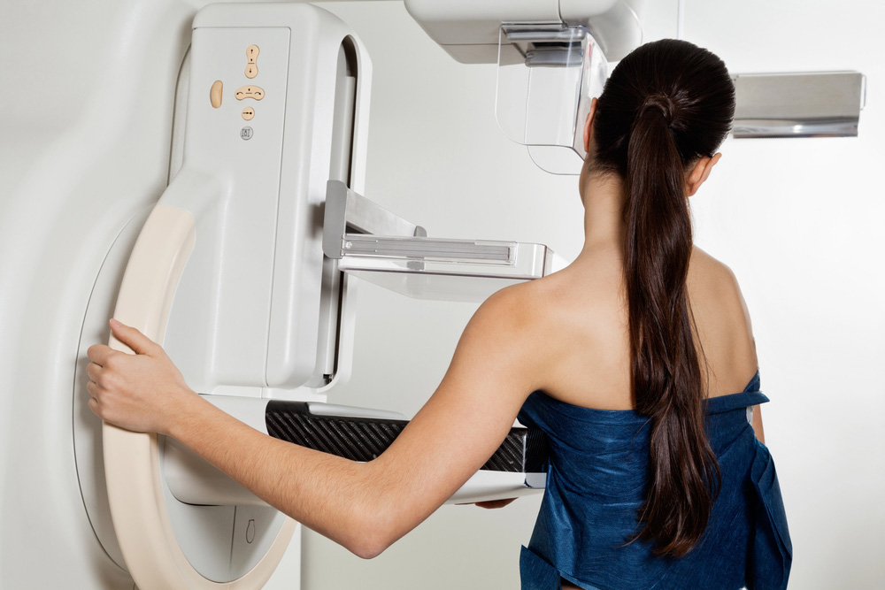 Patient positioning for walk-in mammograms in Houston using advanced digital mammography unit for precise breast imaging.