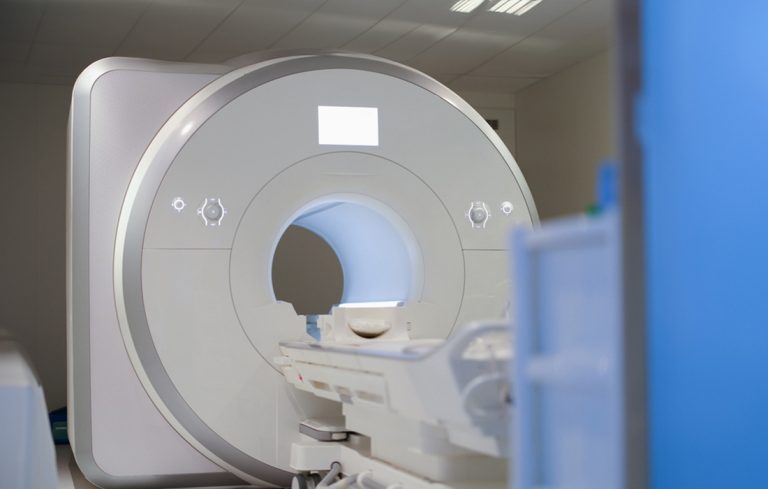 Modern MRI scanner machine in a clean clinical room, ready for diagnostic imaging at leading MRI Houston center for advanced patient care.