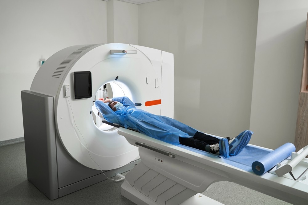Patient in a blue gown preparing for cheap CT scans at a modern diagnostic imaging center located in Houston.