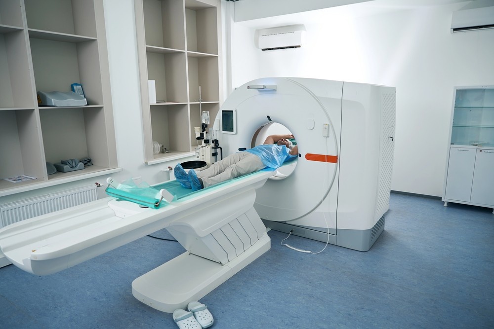 A patient lies on a CT scanner table for affordable diagnostic imaging like cheap ct scans in Houston.