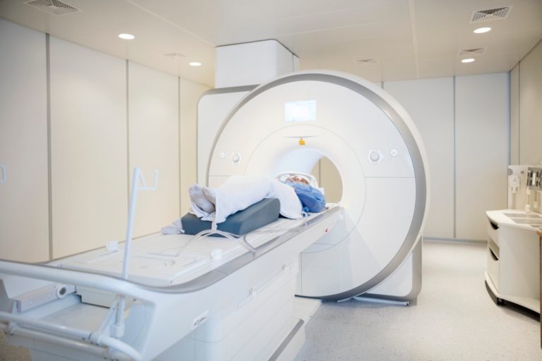 A patient prepares for a scan inside a state-of-the-art machine, highlighting professional mri services houston.
