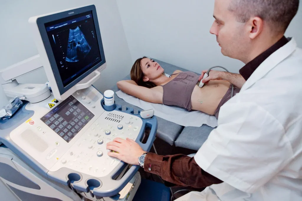 Woman gets an affordable stomach scan at the cheap ultrasound Houston office for reliable diagnostic testing.