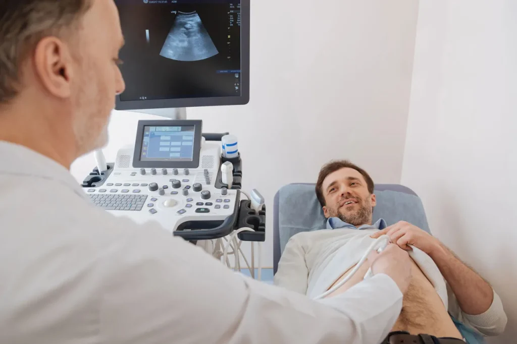 Doctor performs a cheap ultrasound Houston clinic patients trust for affordable abdominal imaging scans.